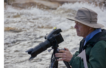 Charles Cramer photogaphing in the field