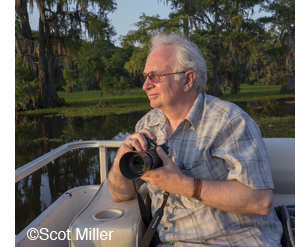 Dan Burkholder with OM-D camewra at Caddo Lake, photo by Scot Miller